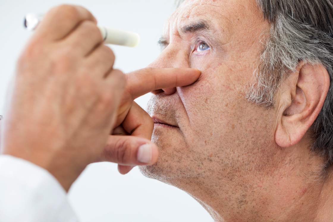 Elderly man examined by an ophthalmologist stock photo